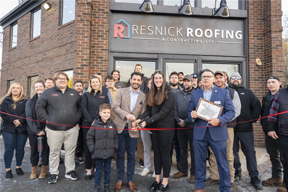 Resnick Roofing & Contracting's team celebrating their office opening