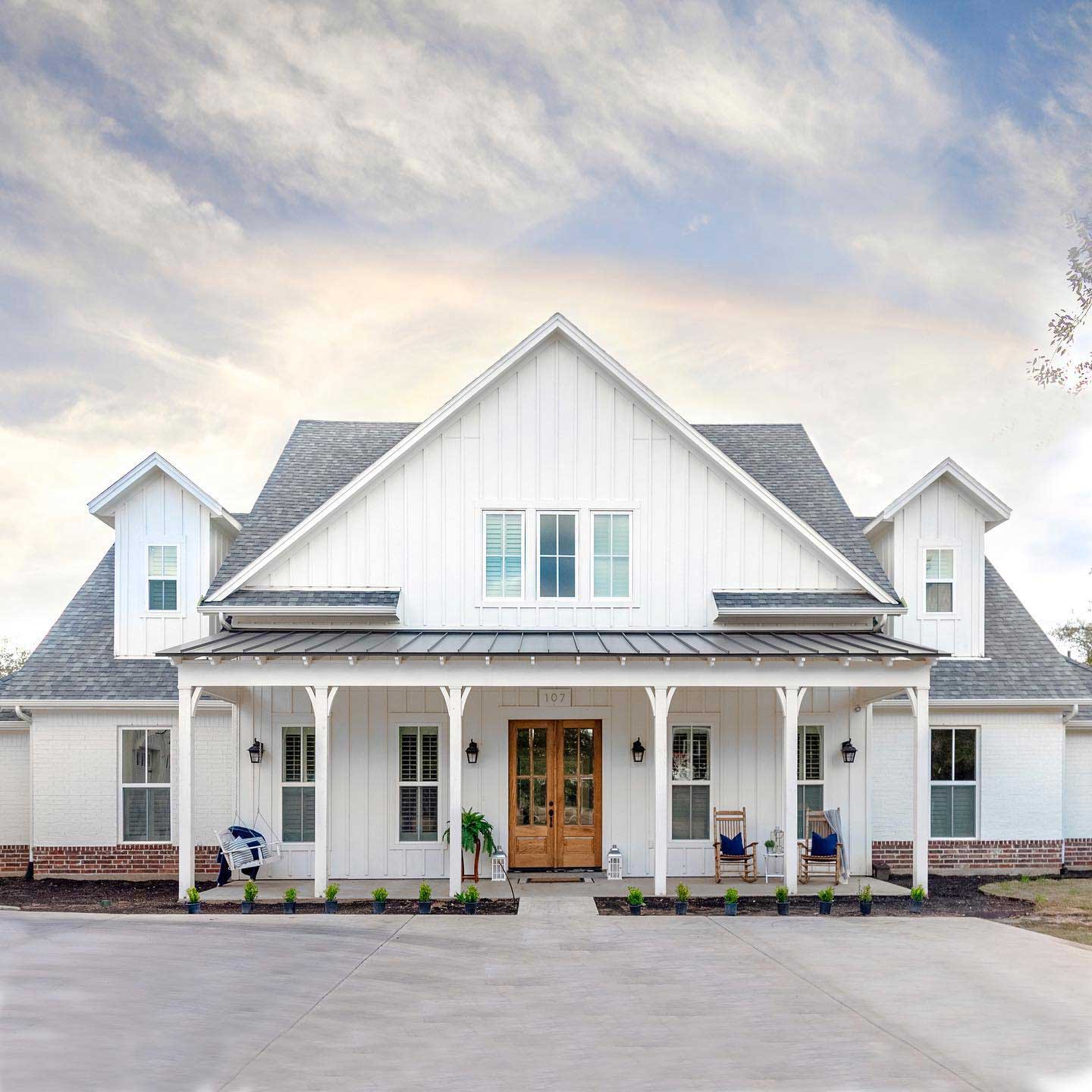 White farmhouse-style home with new James Hardie siding